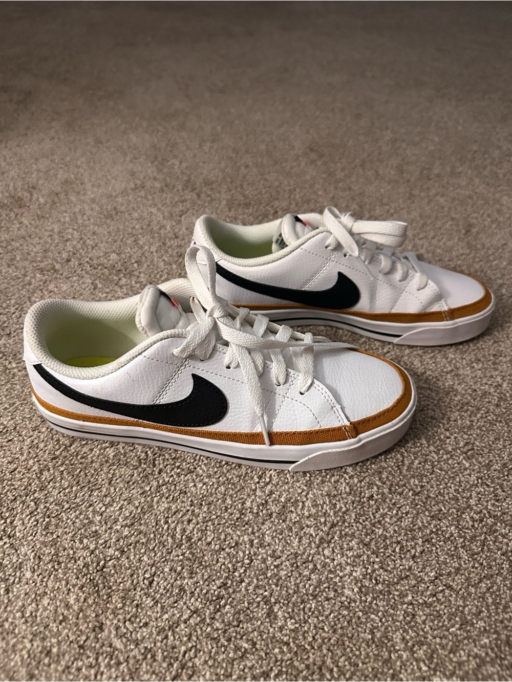 Nike White Sneakers with Black Swoosh and Brown Trim